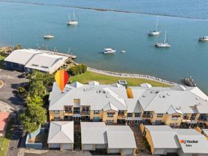 an aerial view of a building next to the water at Riverview Apartment 1.4 in Iluka
