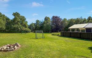 a soccer field with a goal in the grass at Cozy Home In Jerup With Wifi in Jerup +11 photos