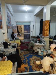 a group of people sitting in a room at Grand Backpackers Hostel Luxor in Luxor