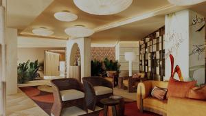 a lobby with a couch and chairs in a room at Casa de Sada Algarve Beach Resort, Curio Collection by Hilton in Armação de Pêra +43 photos