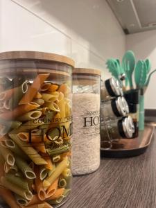 a jar of pasta and rice on a counter at Exclusivo departamento in Valdivia