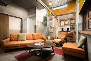 a living room with a couch and a table at The Deer Park Inn in Nara