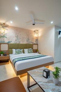 a bedroom with a large bed in a room at Hotel IKOY A Luxury Boutique Near Ashok Vihar & Model Town in New Delhi +74 photos
