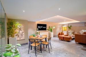 a lobby with a table and chairs and a couch at Hotel IKOY A Luxury Boutique Near Ashok Vihar & Model Town in New Delhi