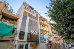 a building with a kox sign on the side of it at Hotel IKOY A Luxury Boutique Near Ashok Vihar & Model Town in New Delhi