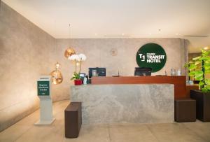 a restaurant with a counter with a cash register at Changi Transit Hotel Terminal 1 in Singapore