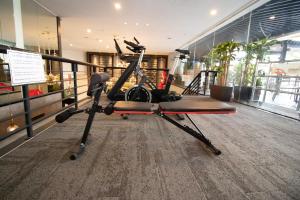 a gym with cardio equipment in a building at Changi Transit Hotel Terminal 1 in Singapore