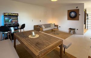 a living room with a couch and a table at Villa Aqua in Vrbanj