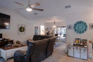 a living room with a couch and a ceiling fan at Roxy in Brunswick