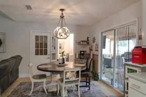 a kitchen and dining room with a table and chairs at Roxy in Brunswick