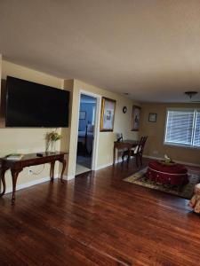 a living room with a large flat screen tv at The Pecan House in Bainbridge