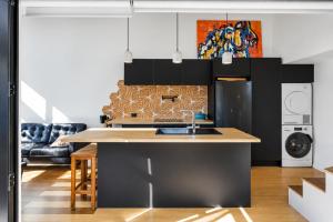 a kitchen with a sink and a counter top at Tiny House - Big Luxury in Wanaka