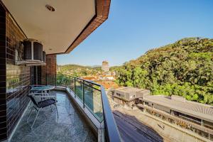 a balcony with a chair and a train station at Hotel Prinz in Joinville