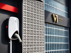 a pay phone on the side of a building at V1 boutique hotel in Kanchanaburi City