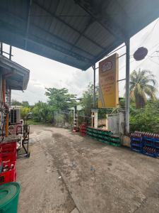 an outdoor market with a building with a sign at RF Hotel Transient House in Bangued