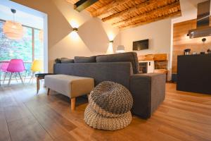 a living room with a couch and a table at Xalet Les Avellanes - hut 7335 in Arinsal