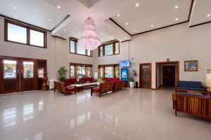 a hospital lobby with chairs and a chandelier at Cheathata CTS Hotel Siem Reap in Siem Reap +99 photos