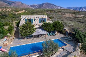 an aerial view of a house with a swimming pool at Sea-Sunset Views Villa Lefkothea with Private Pool near Elafonissi in AmigdhalokeFálion