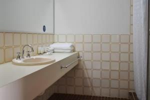 a bathroom with a sink and a mirror at Admiral Motel Bunbury in Bunbury +29 photos