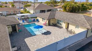 an aerial view of a house with a swimming pool at Downtown Breeze in Cape Coral