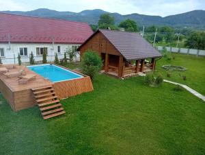an overhead view of a backyard with a pool and a house at Садиба Буквиця in Migovo