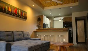 a living room with a couch and a table at Big Blue Sodwana Bay in Sodwana Bay