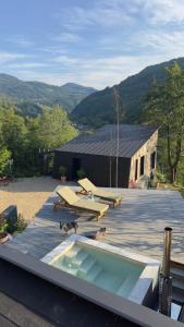 a group of picnic tables on the roof of a building at Cabana207 - Private Mountain Cabin with Hot Tub in Bulz