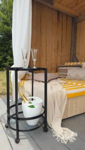 a table with a bowl and wine glasses on it at Cabana207 - Private Mountain Cabin with Hot Tub in Bulz +72 photos