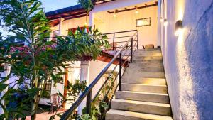 a staircase leading up to a house with plants at Surf and stay in Weligama +3 photos