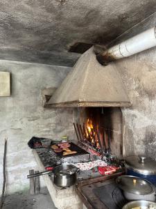 a kitchen with a large oven with food in it at Villa Linda in Schio +12 photos