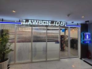a lawson sign on the door of a store at The Quarter Ploenchit by UHG in Bangkok +102 photos