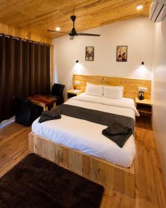 a bedroom with a large bed in a room at Basera At Palolem in Canacona