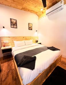 a bedroom with a large bed in a room at Basera At Palolem in Canacona