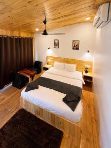 a bedroom with a large bed in a room at Basera At Palolem in Canacona