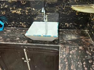 a sink on top of a counter in a bathroom at Dixit's Villa in Kānpur