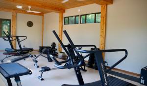 a gym with three exercise bikes in a room at Big Blue Sodwana Bay in Sodwana Bay