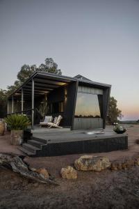 a house with a large window on the side of it at Heyscape Busselton in Busselton