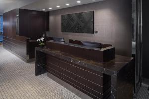 a bathroom with a large counter with a sink at Park South Hotel, part of JdV by Hyatt in New York