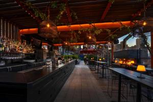 a bar with a view of a city at Park South Hotel, part of JdV by Hyatt in New York