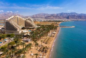 an aerial view of a beach with palm trees and hotels at קרוואן על הים in Eilat