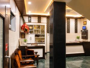a lobby of a store with chairs and a counter at Hotel Goverdhan - Walking to Raja Ki Mandi Railway and 3km from ISBT in Agra