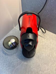 a red blender sitting on top of a table at MOuntain View Apartment in Câmpulung
