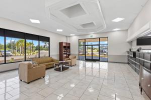 a lobby with couches and chairs in a building at Quality Inn Sumter near Shaw AFB in Sumter