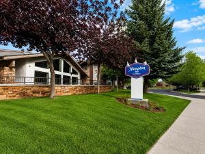 a sign in the grass in front of a house at Hampton Inn By Hilton Hailey Sun Valley in Hailey