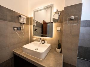 a bathroom with a sink and a mirror at The cloud ella in Ella +42 photos