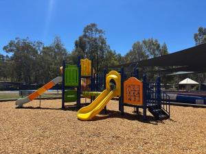 a playground with a slide in a park at Ingenia Holidays Murray Bend in Koonoomoo