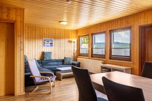 a living room with a couch and a table at Bergpanorama Ruhla in Ruhla