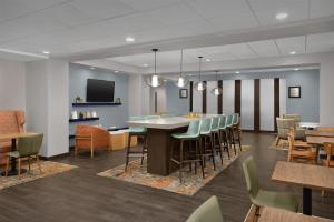 a conference room with a large table and chairs at Hampton Inn Kernersville in Kernersville