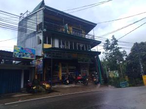 a building with motorcycles parked in front of it at K K Kumar Guest in Norwood