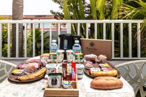 a table with a bunch of food and drinks on it at Smart Hotel Cabo Sur in Mojácar